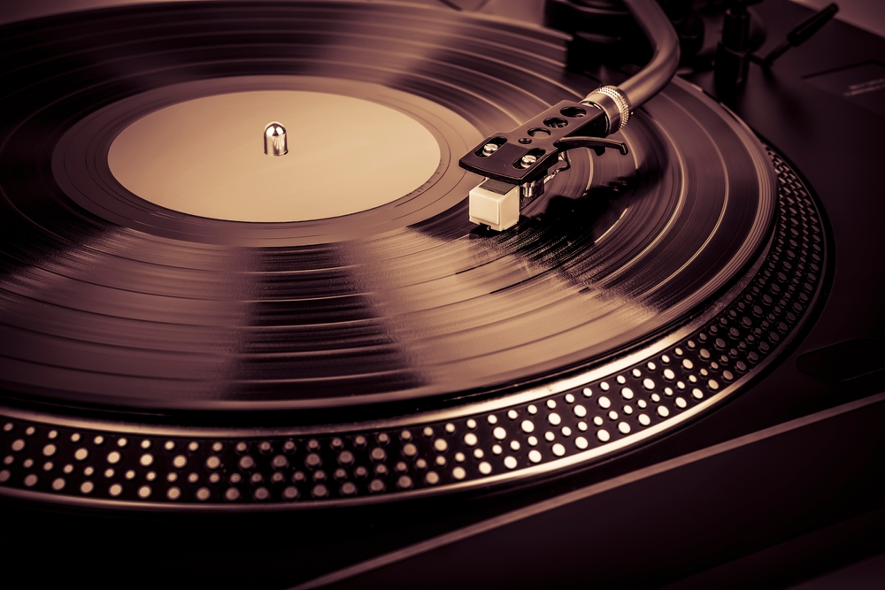 A needle on a turntable playing music, showcasing high-quality audio equipment from a trusted audio visual equipment supplier
