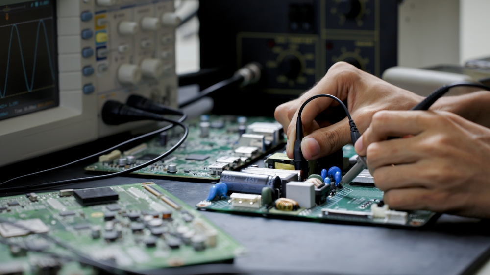 Technician performing meticulous maintenance on audio visual equipment in new orleans, ensuring optimal performance and longevity of high-end devices.