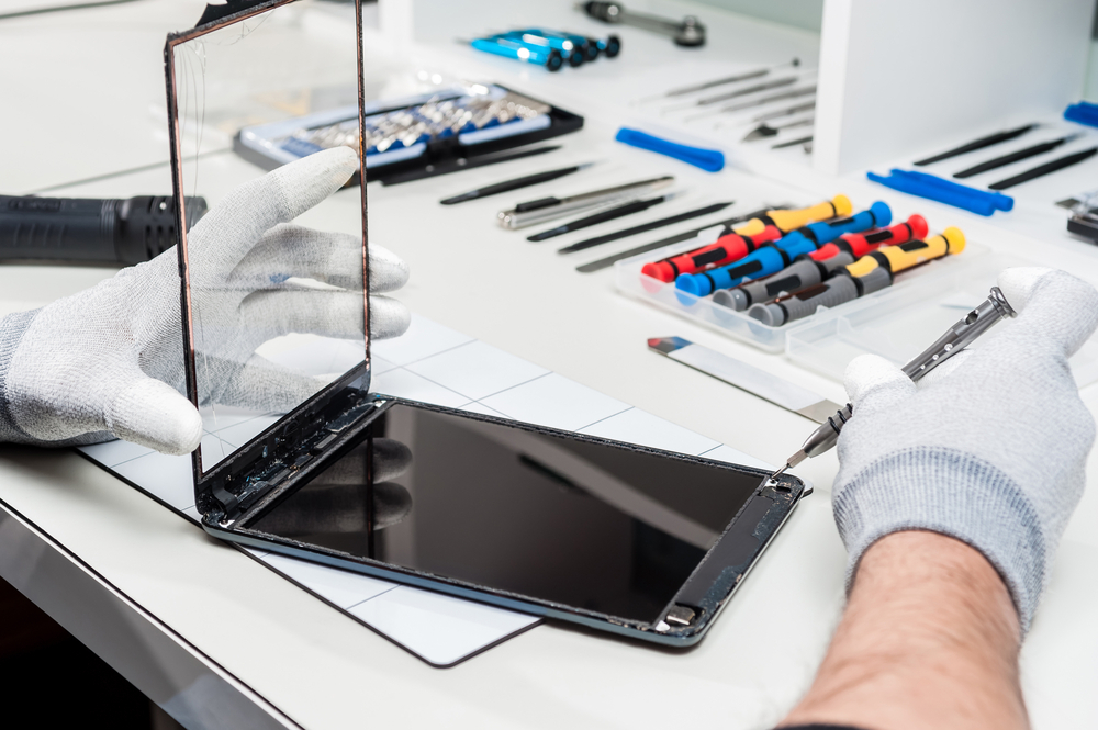 Detailed close-up images showcasing the smartphone and tablet repair process by expert technicians in an electronics repair store