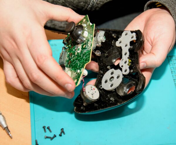Game console repair service, electronics and joystick repair, PlayStation and virtual game maintenance at audio visual equipment supplier center.