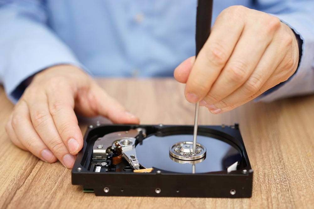 Engineer is recovering data from failed hard disk drive - how to recover lost files - Audio visual equipment repair service